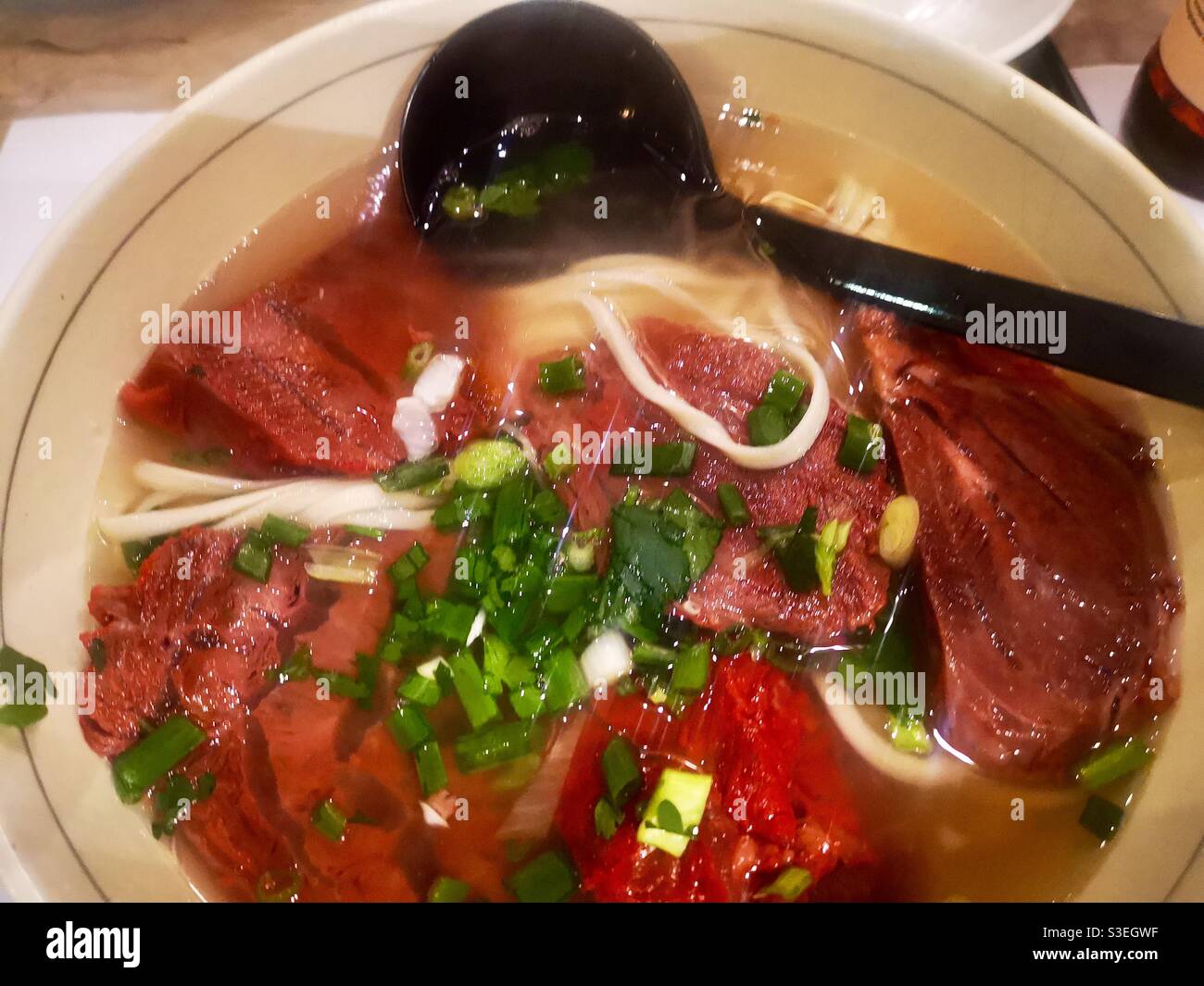 Chinese beef soup with hand-pulled noodles. - Smartphone Captured Stock Image