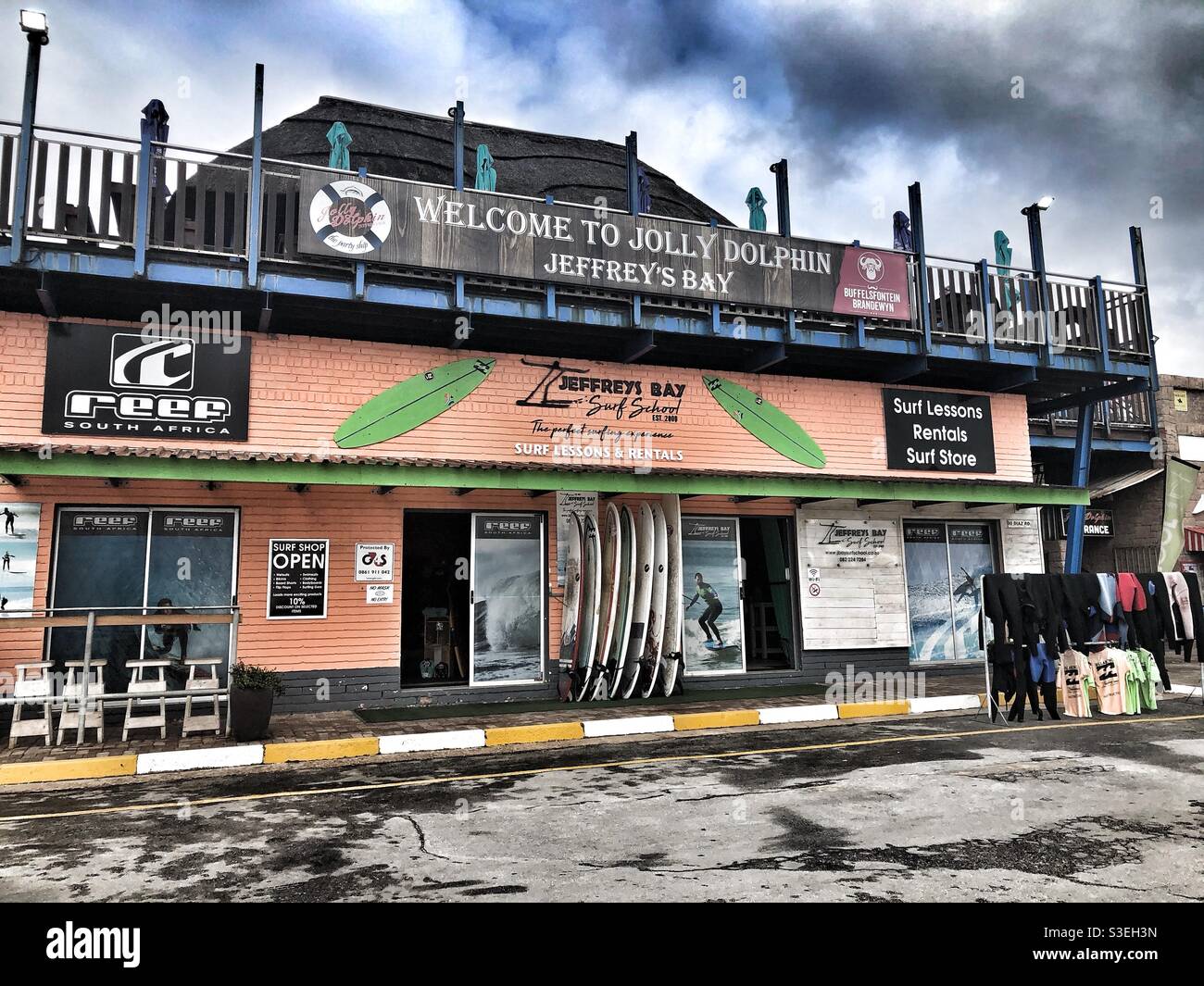 Surf school and Jolly Dolphin in Jeffrey’s Bay, South Africa - Smartphone Captured Stock Image