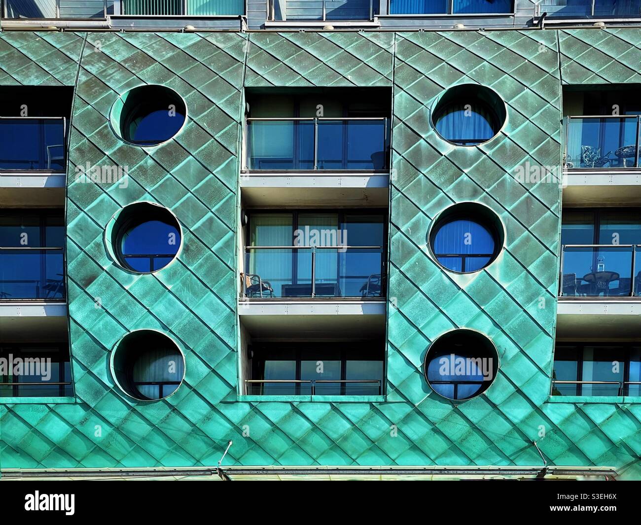 Copper fronted building with green patina, in Porthcawl, South Wales. - Smartphone Captured Stock Image