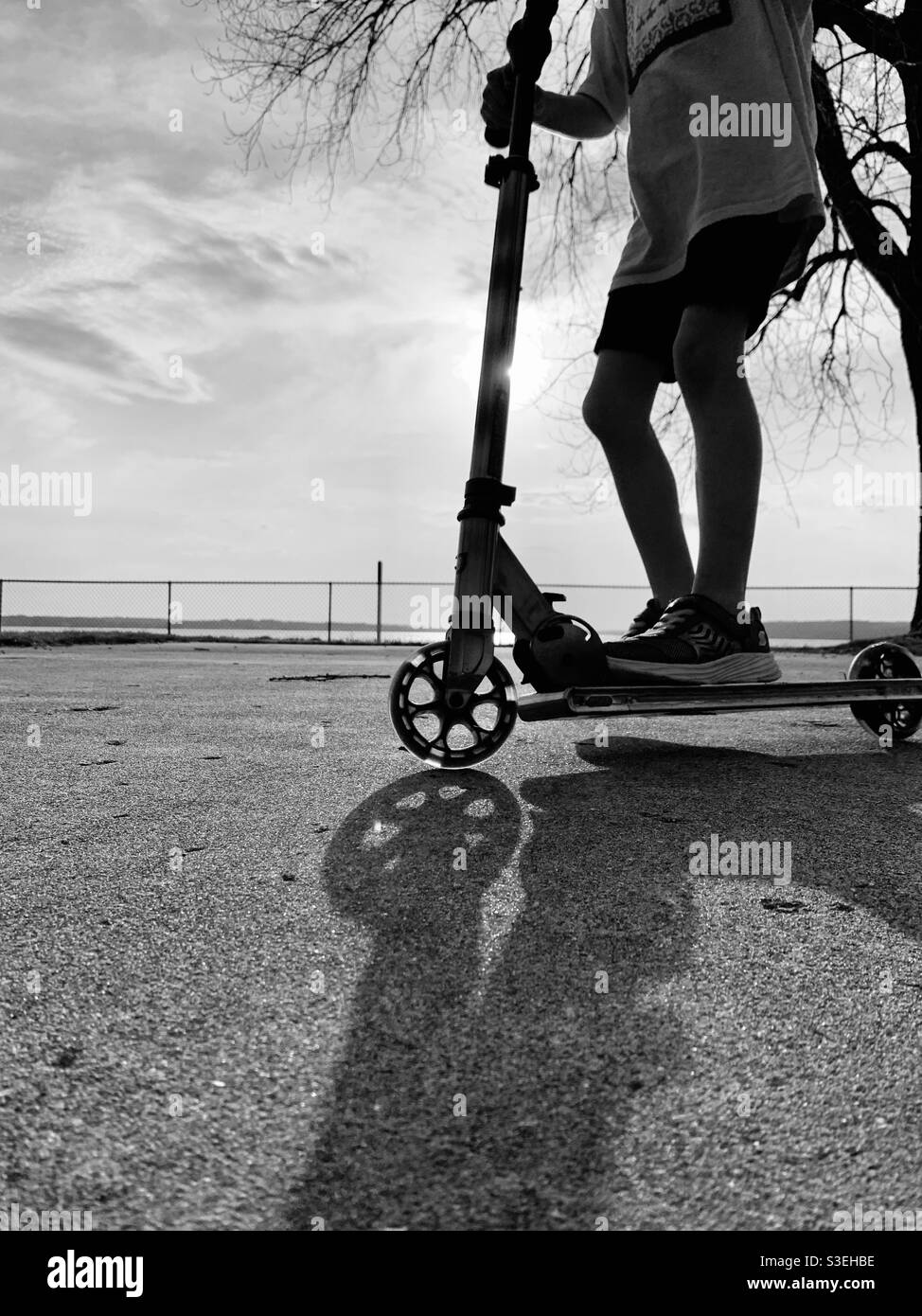 Young child riding a scooter Stock Photo Alamy