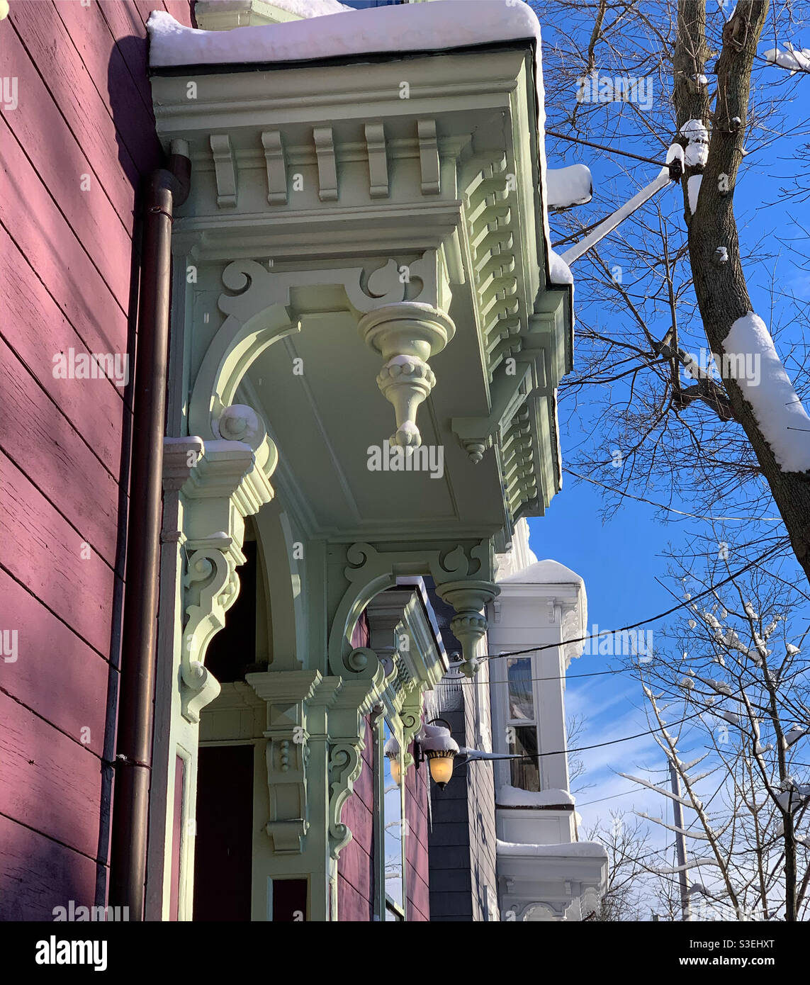 December, 2020, woodwork around the front door of a home near downtown Salem, Massachusetts, United States - Smartphone Captured Stock Image