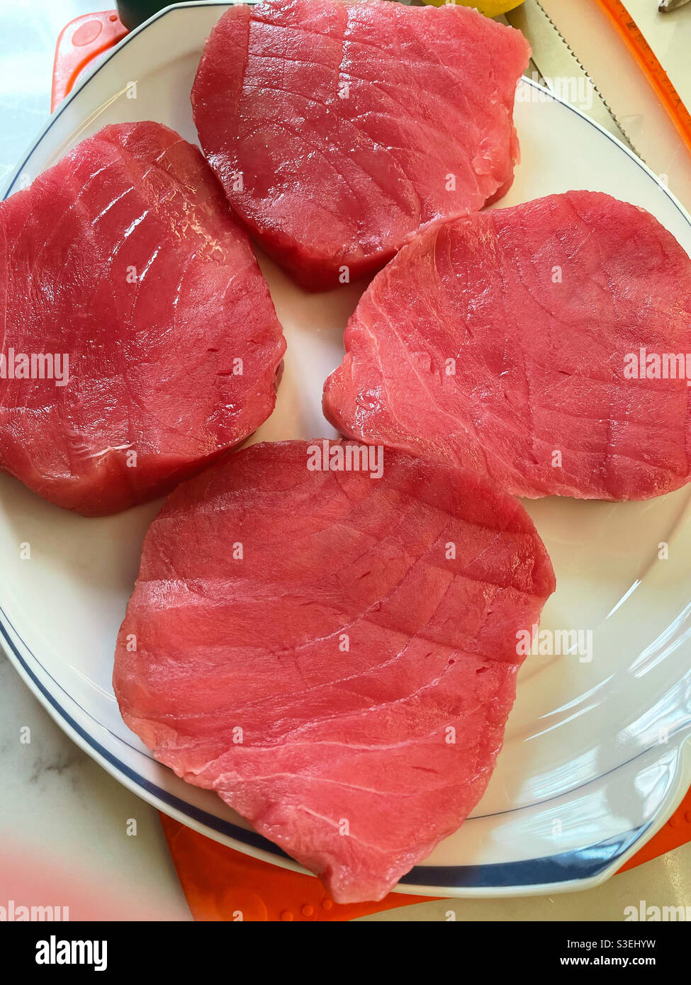Close up of four sushi grade ahi tuna steaks - Smartphone Captured Stock Image