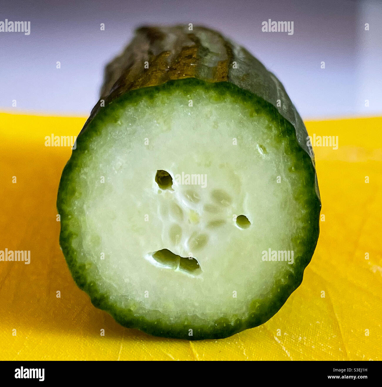 Sad Face Sliced Cucumber Stock Photo