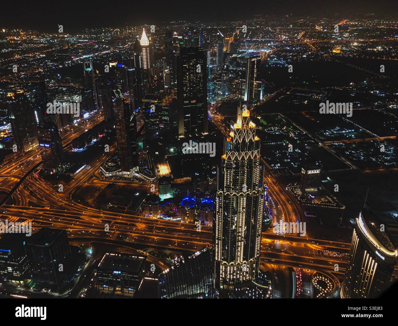 Dubai night city view from Burj Khalifa tower, UAE. - Smartphone Captured Stock Image