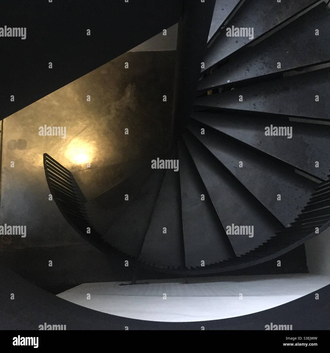 Art of black spiral staircase in a hotel in Bangkok Stock Photo