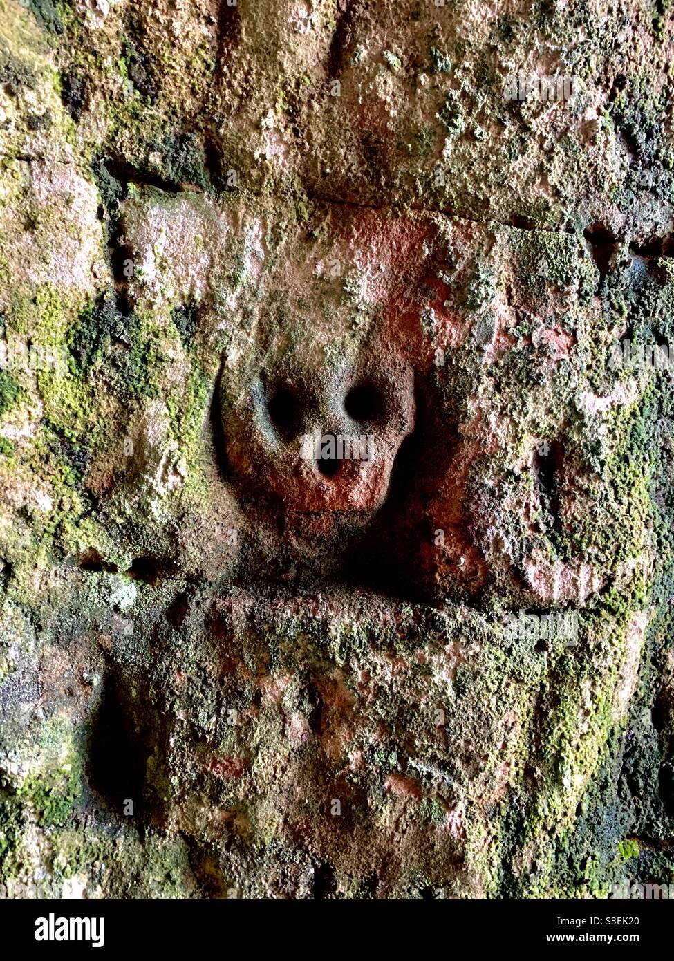 Old carving found in a cave Stock Photo