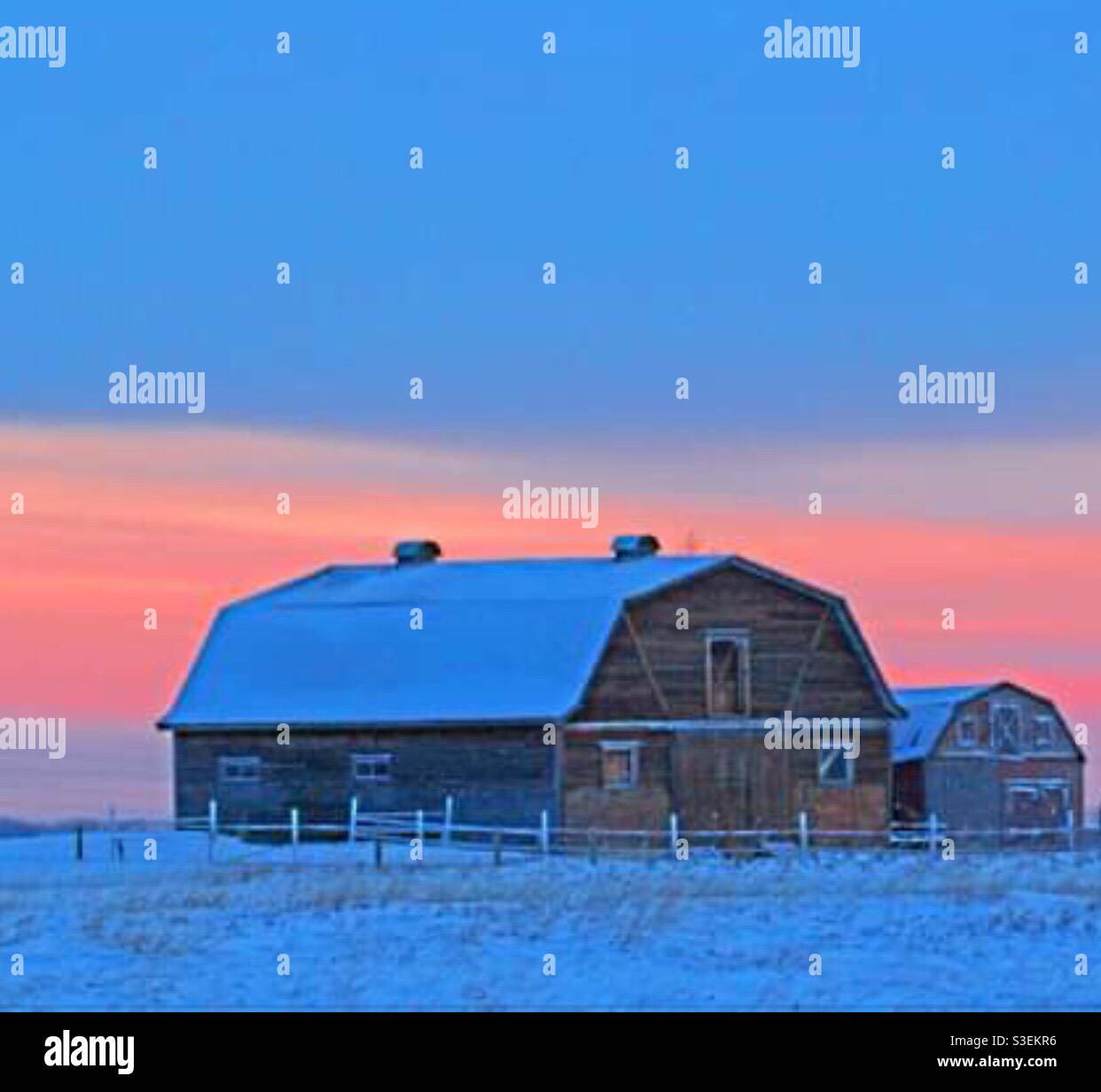 Two barns, sunrise, contrast, big - little, Size matters - Smartphone Captured Stock Image
