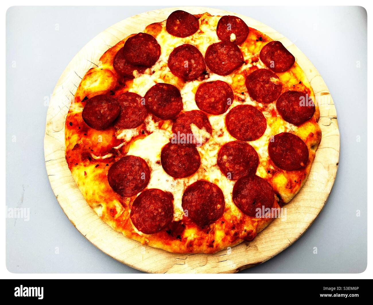 Pepperoni and cheese thin crust pizza Stock Photo