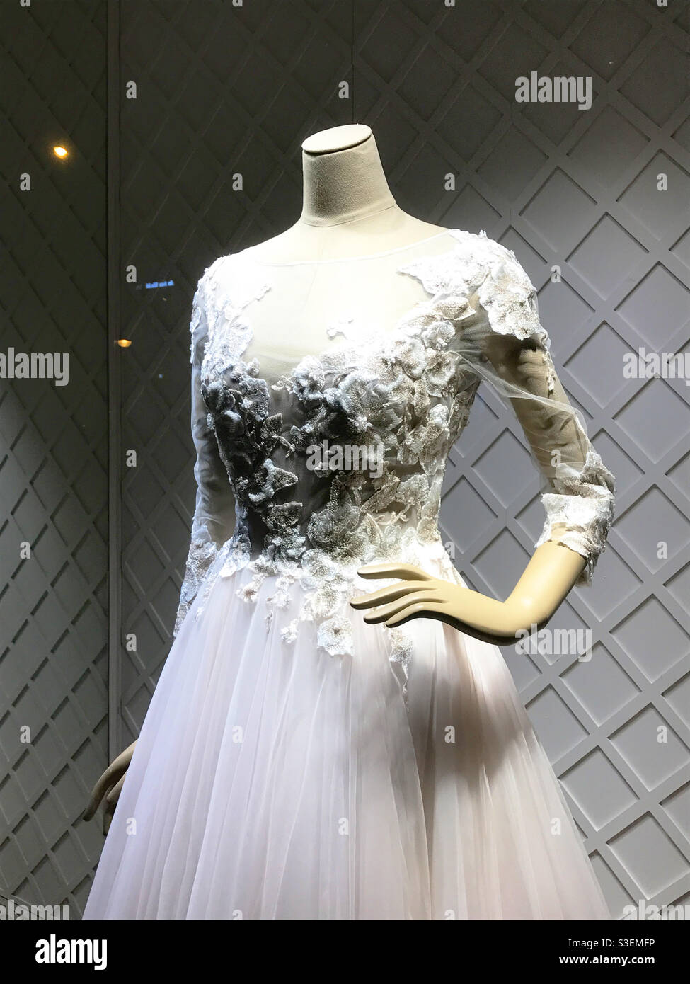 Wedding dress un a shop window. - Smartphone Captured Stock Image