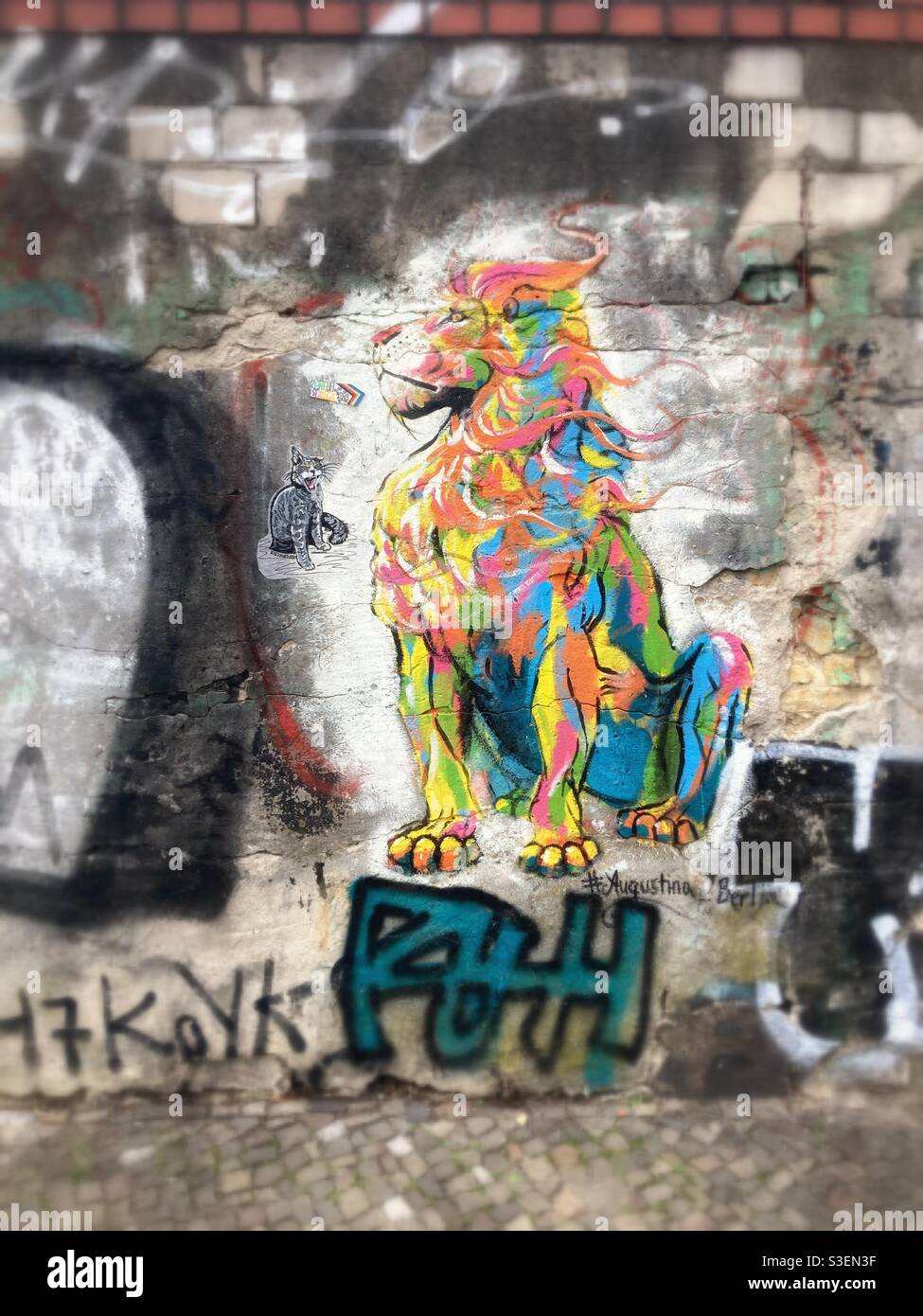 A Colourful Lion Graffiti # Augustina Berlin on a Brick Wall in the Berlin District of Kreuzberg, Germany - Smartphone Captured Stock Image
