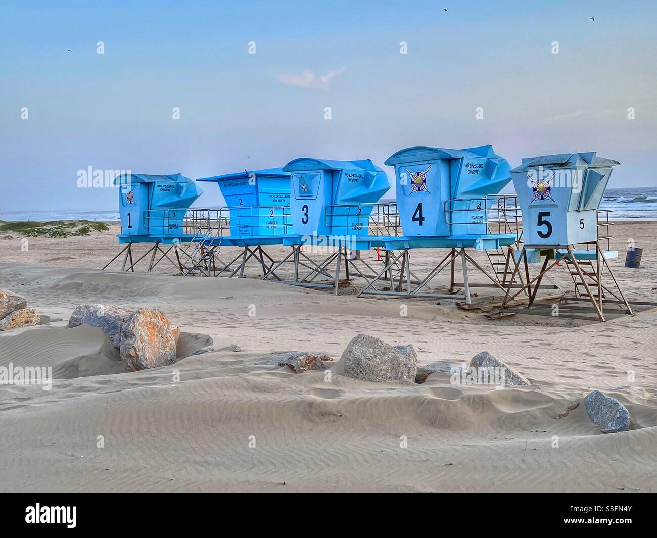 Life guard towers sitting in a row on the beach in Pismo Beach California. Just waiting for summer to arrive. - Smartphone Captured Stock Image