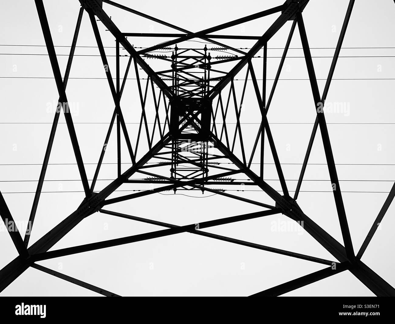 Abstract black and white metal construction of pover line pylon - Smartphone Captured Stock Image