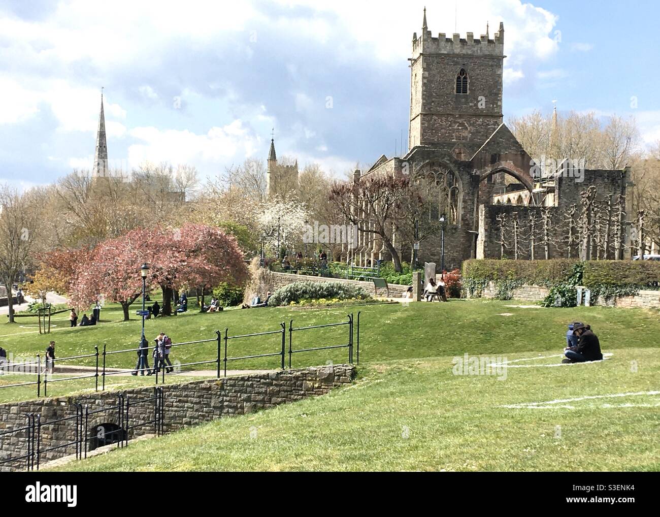 Bristol, UK - 14 April 2021: A view of Castle Park and the ruins of St Peter’s Church on a sunny spring day in Bristol, England, UK. Once a shopping district, the area was mostly destroyed in WWII. Stock Photo