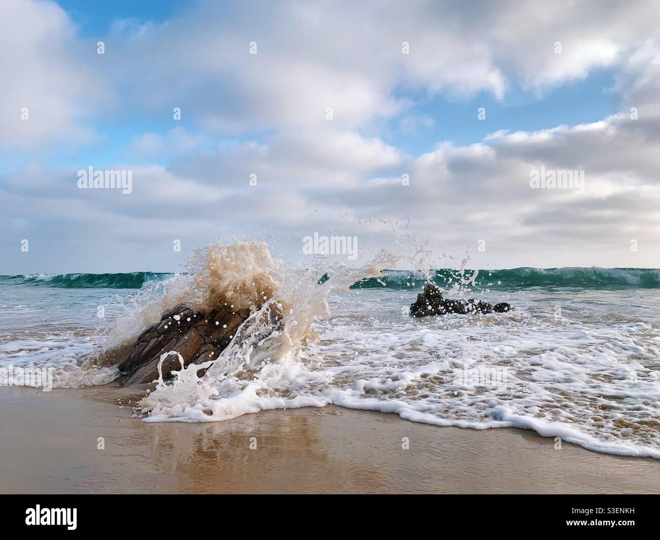 Waves crushing onto beach. - Smartphone Captured Stock Image