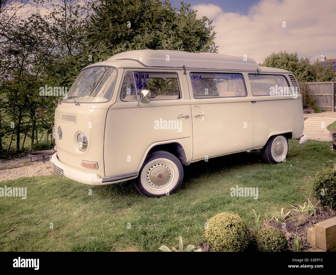 1970’s camper van parked in garden - Smartphone Captured Stock Image