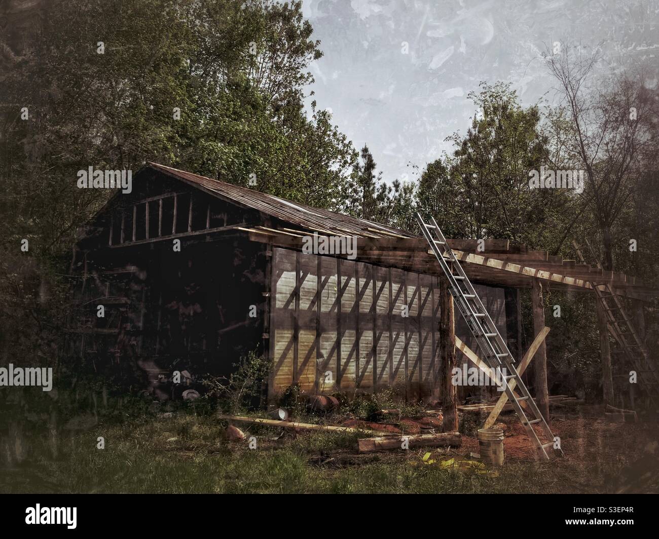 Work shed with addition in process with cross cross shadows - Smartphone Captured Stock Image