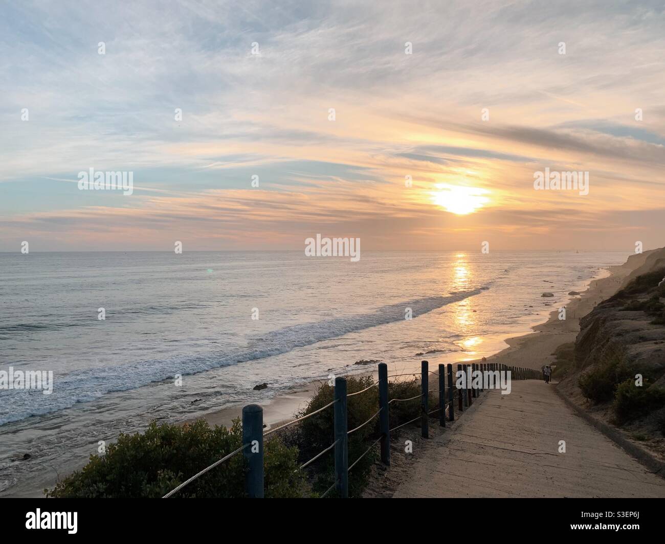 Pathway leading down to the beach at sunset at Crystal Cove State Park in Southern California. Stock Photo