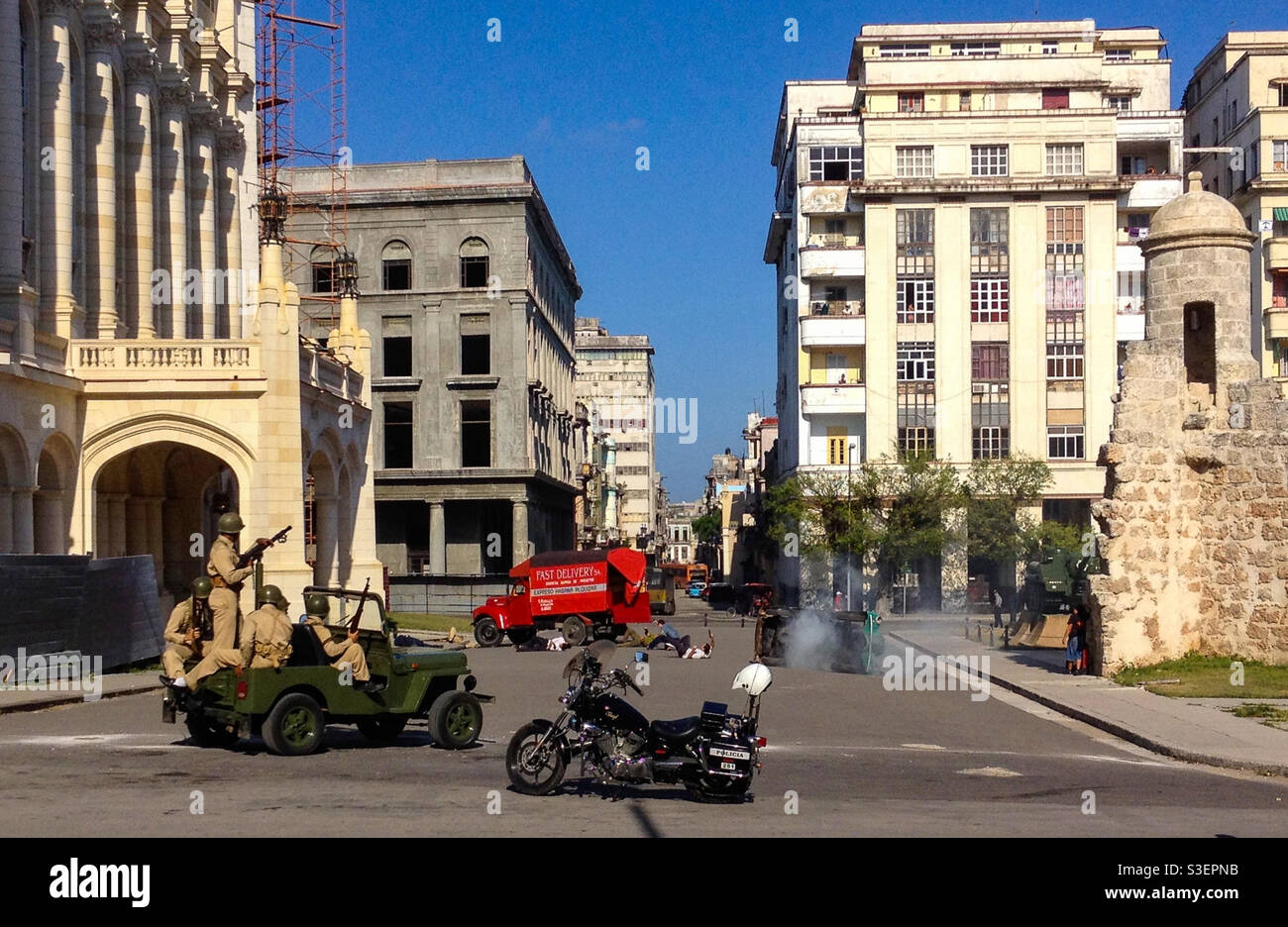 Filming on a film set of an apparent coup with military soldiers at government headquarters building in Havana, Cuba - Smartphone Captured Stock Image