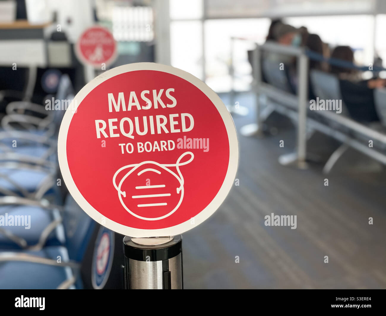 Mask required sign at an airport. - Smartphone Captured Stock Image