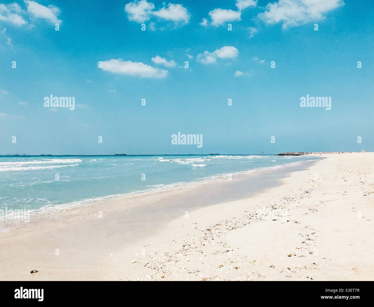 Dubai beach, white sand and blue sky Stock Photo
