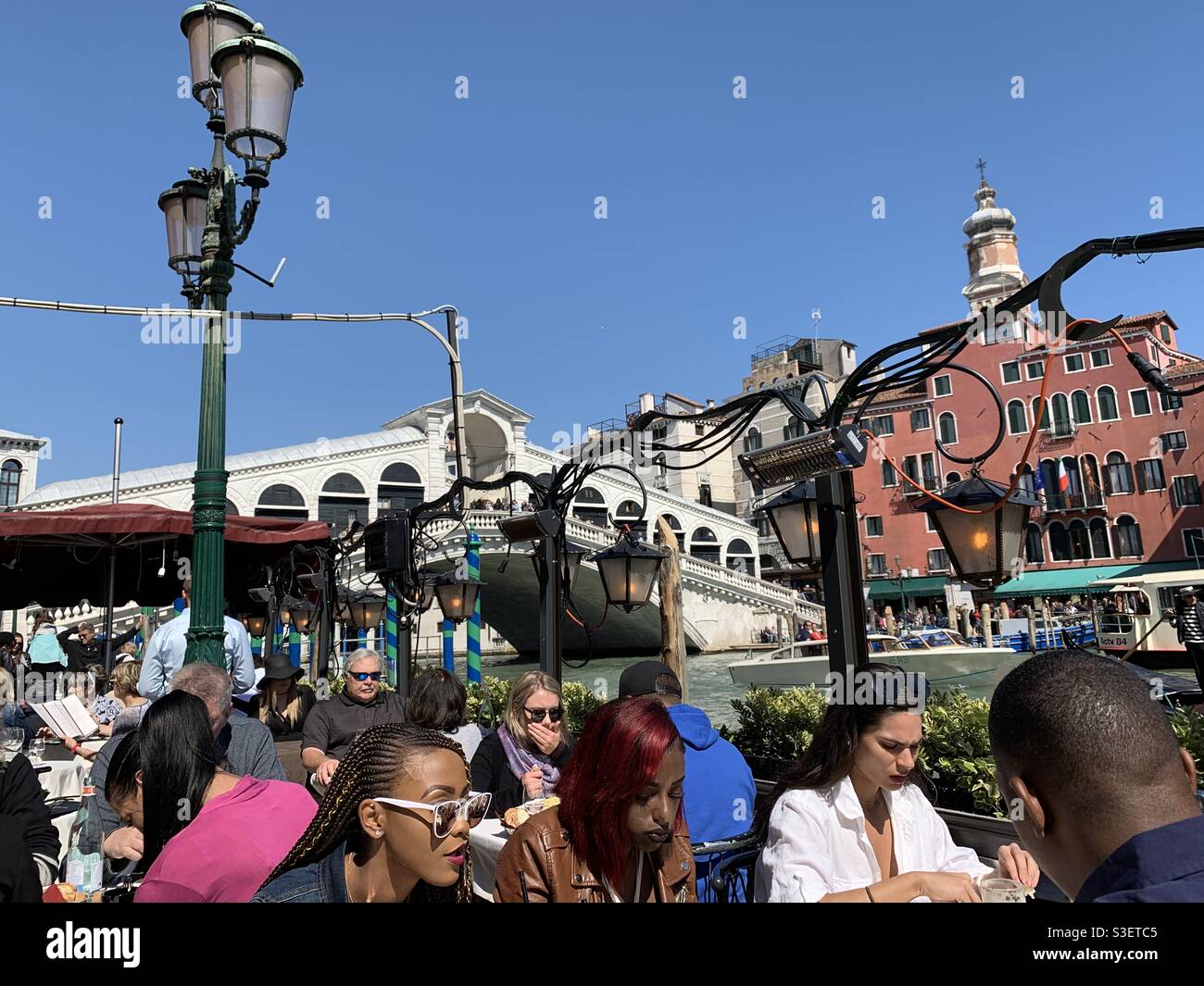 Lunch in Venice facing Rialto bridge. - Smartphone Captured Stock Image