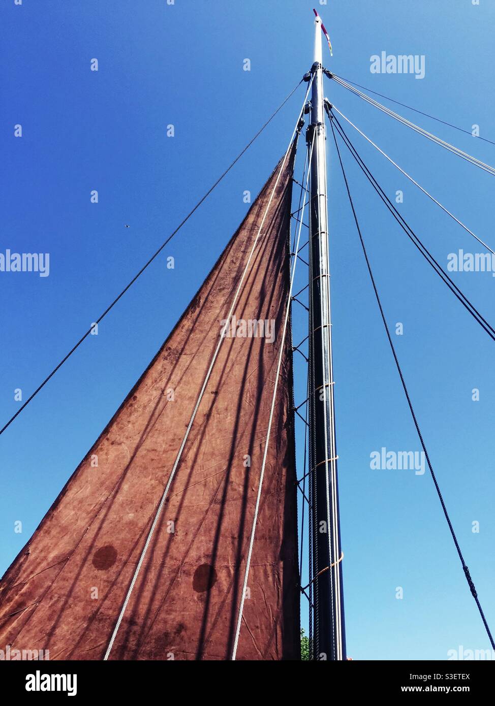 Sail and ropes attached to the mast - Smartphone Captured Stock Image