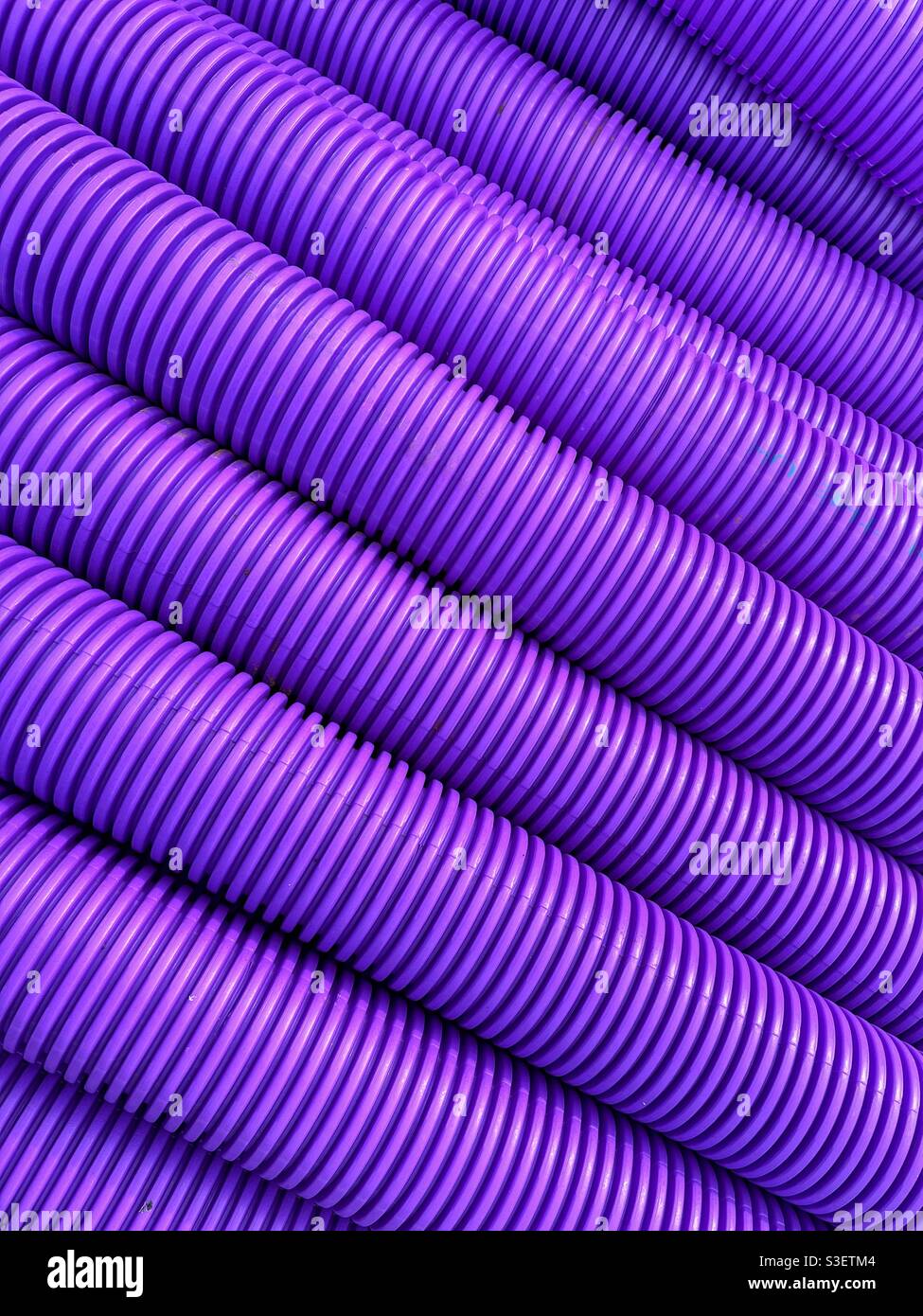 Patterns formed by corrugated plastic piping used for communications cables. - Smartphone Captured Stock Image