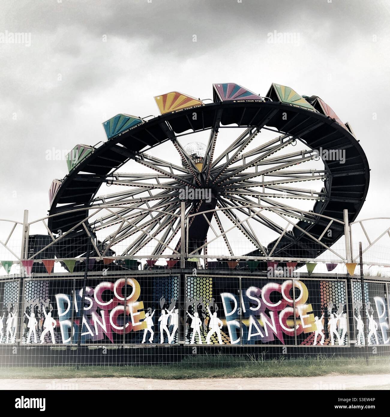 Brightly coloured Disco Dance ride at a fairground - Smartphone Captured Stock Image