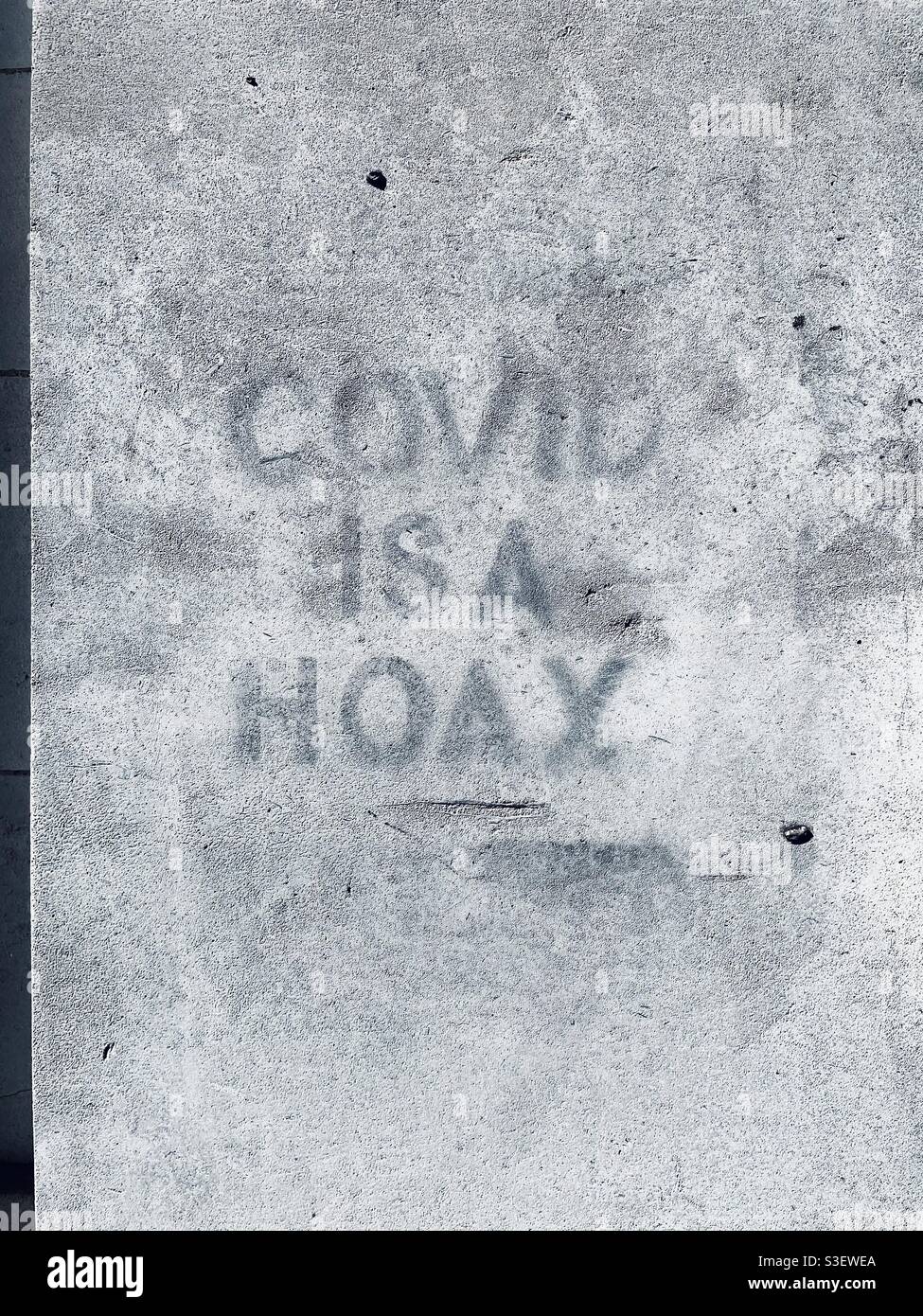Covid is a hoax, stencilled graffiti in 2020 Stock Photo