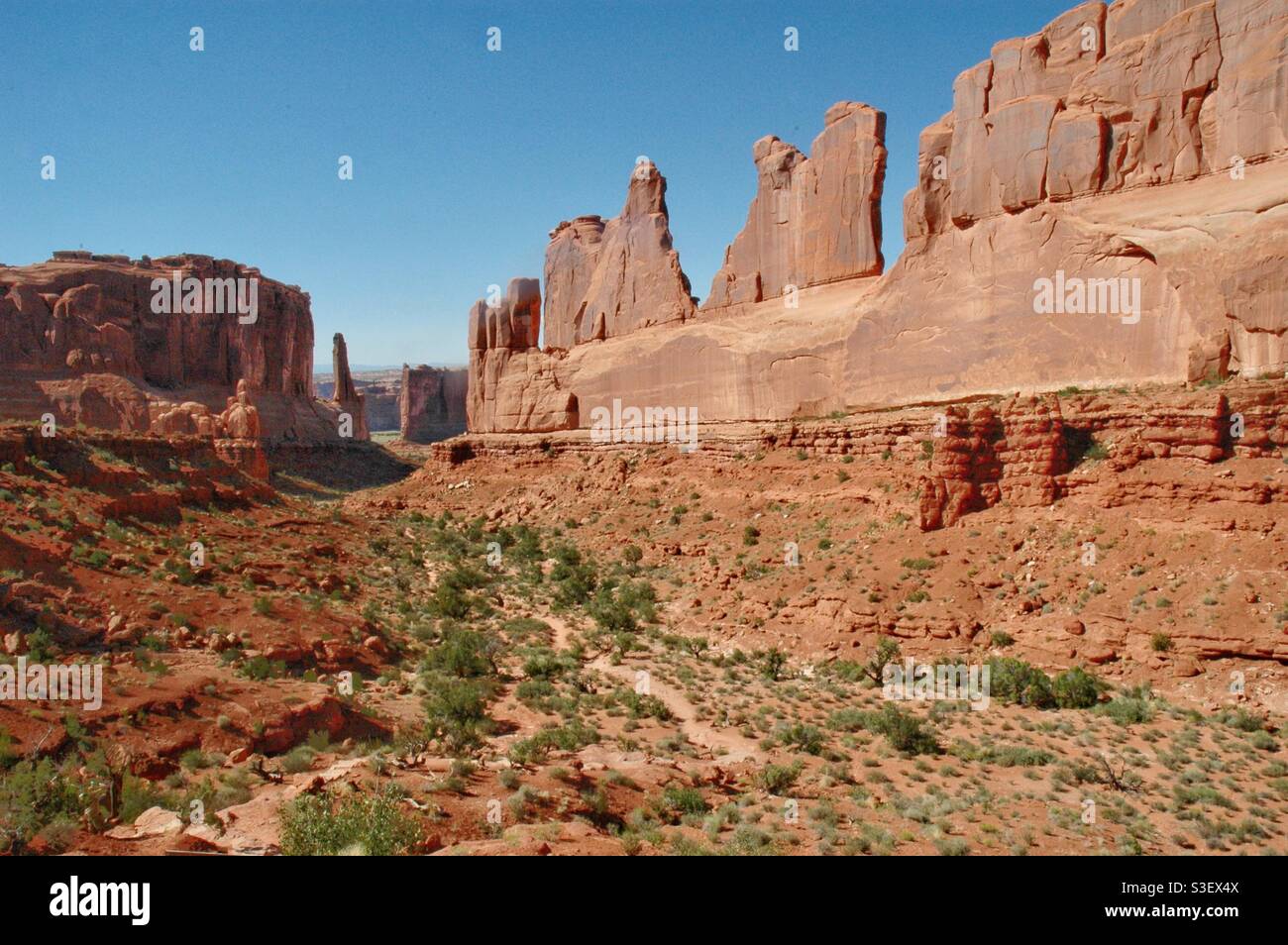 Scenic view of Wall Street rock formation against clear blue sky, park Avenue trail, Arches National Park, Utah - Smartphone Captured Stock Image
