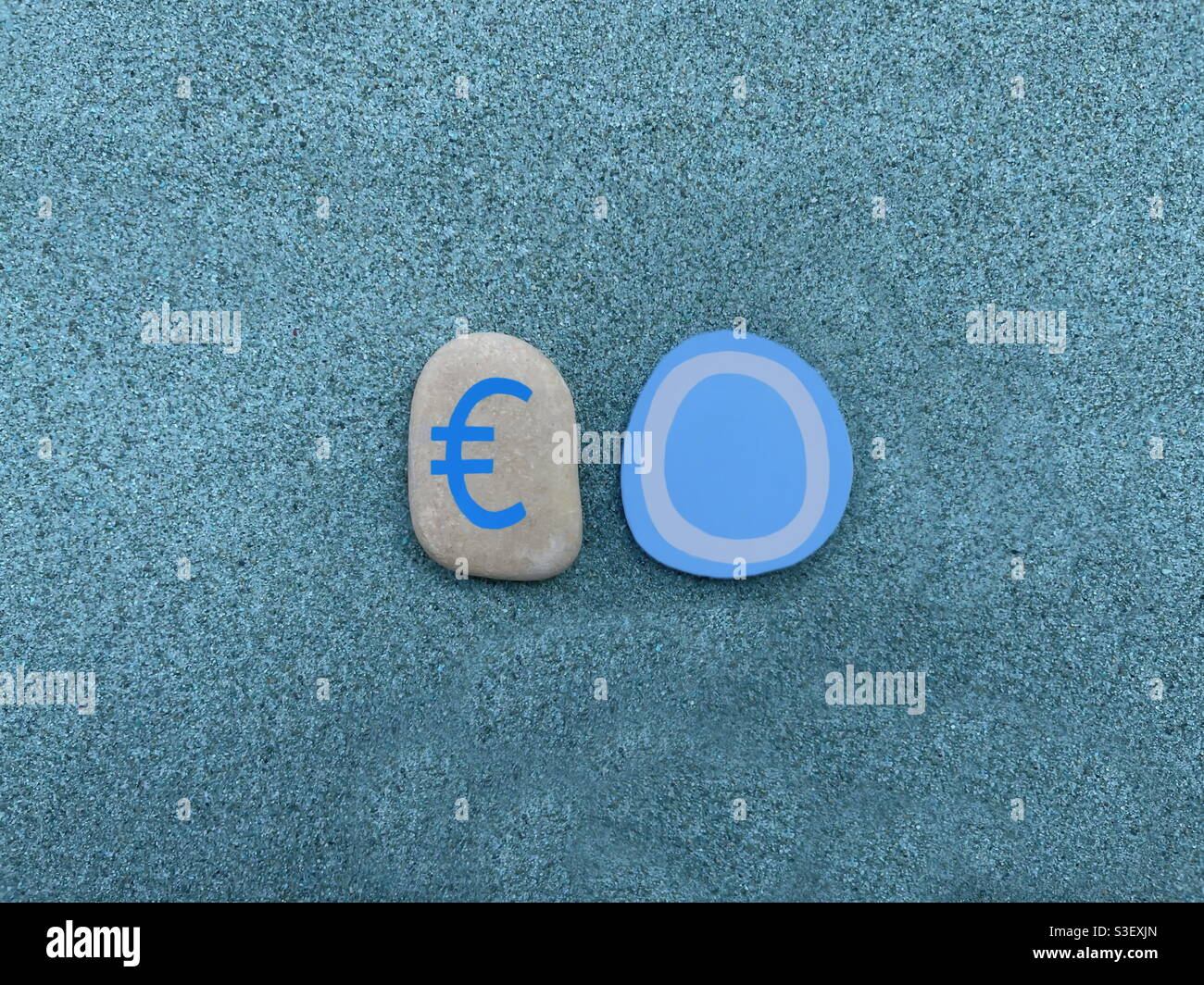Euro zero, no gain, creative composition with handmade stones design over green sand - Smartphone Captured Stock Image