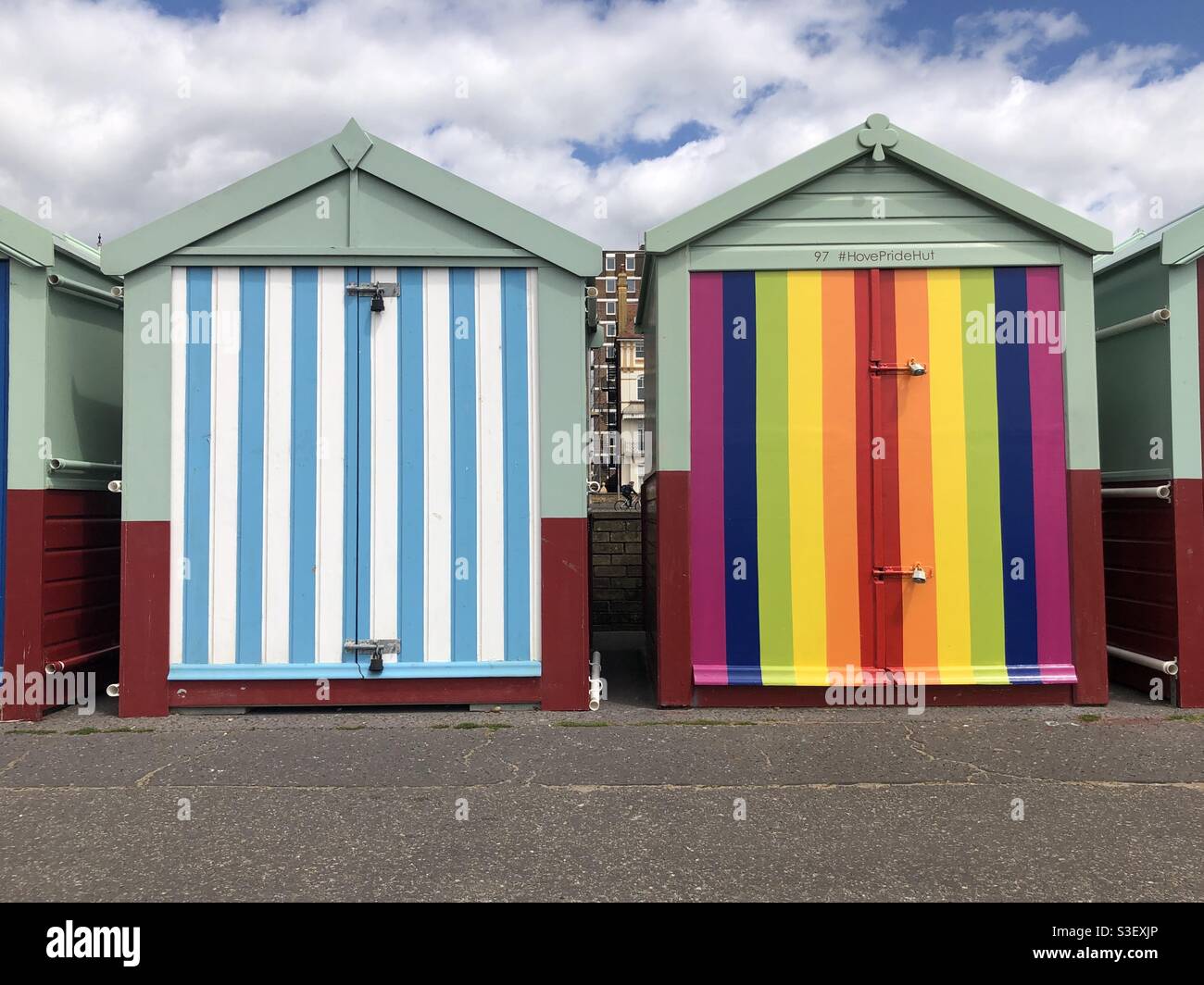 Colourful beach huts on the promenade at Hove Gardens, East Sussex