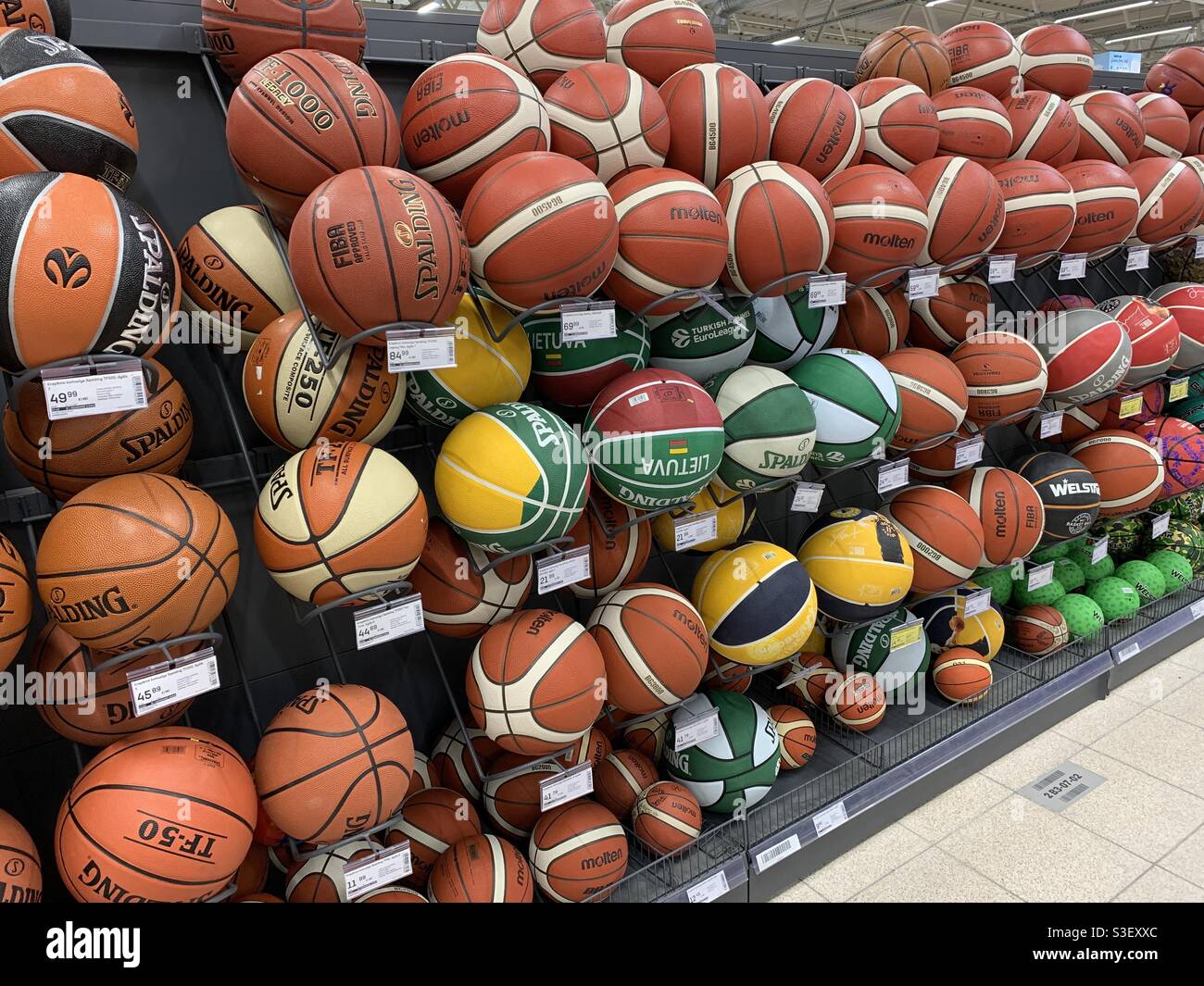 Basketball balls for sale in sport shop Stock Photo - Alamy