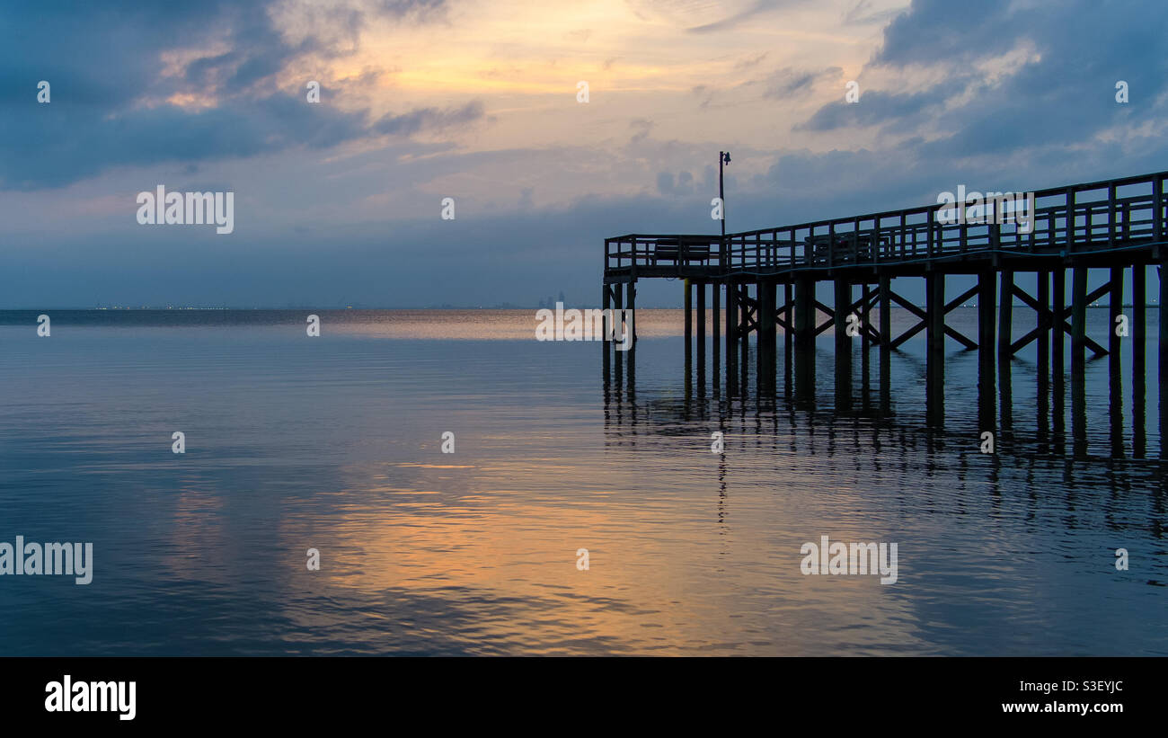 Pier on Mobile Bay at sunset Stock Photo