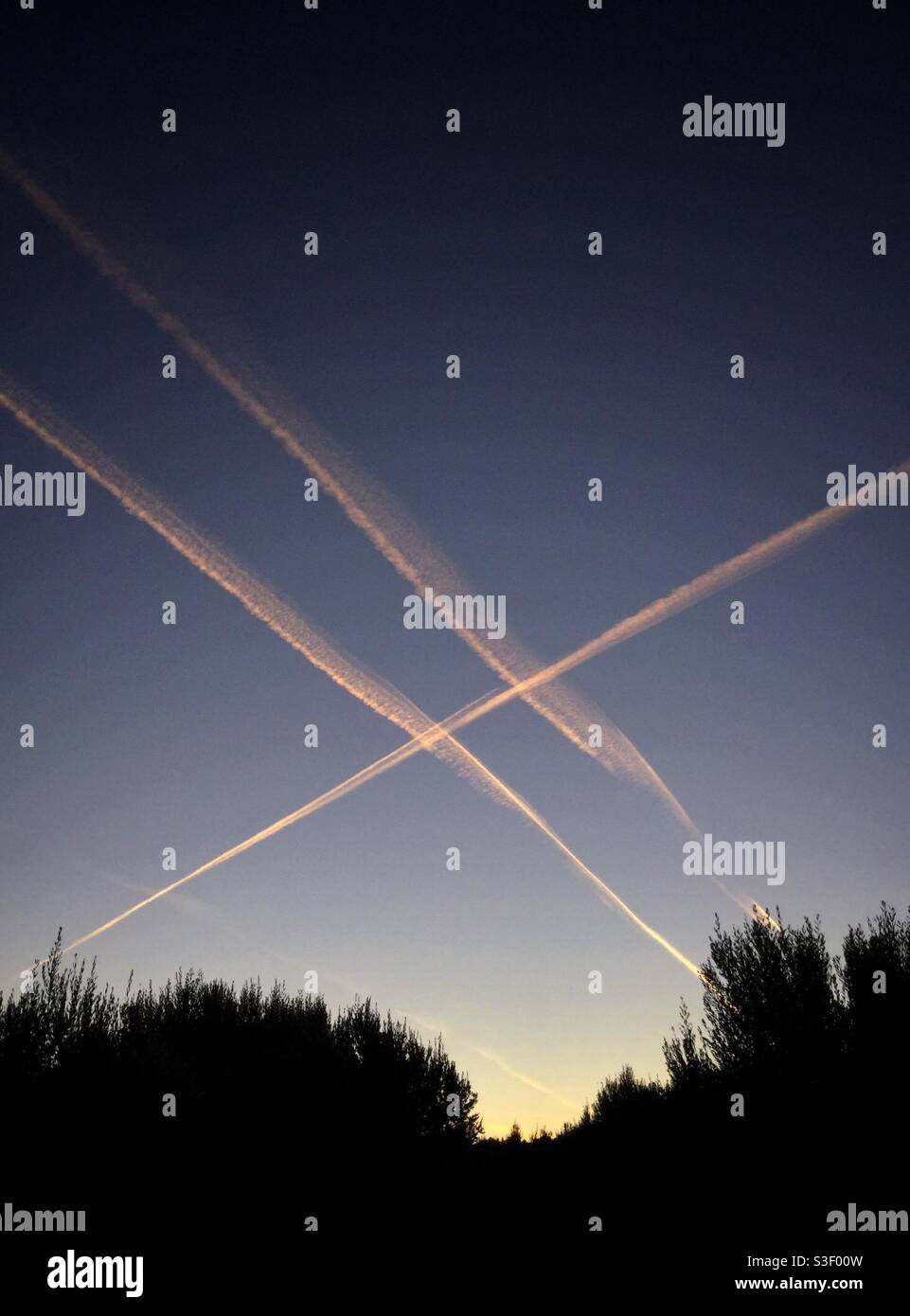 Plane vapour trails in the sky, Catalonia, Spain. - Smartphone Captured Stock Image