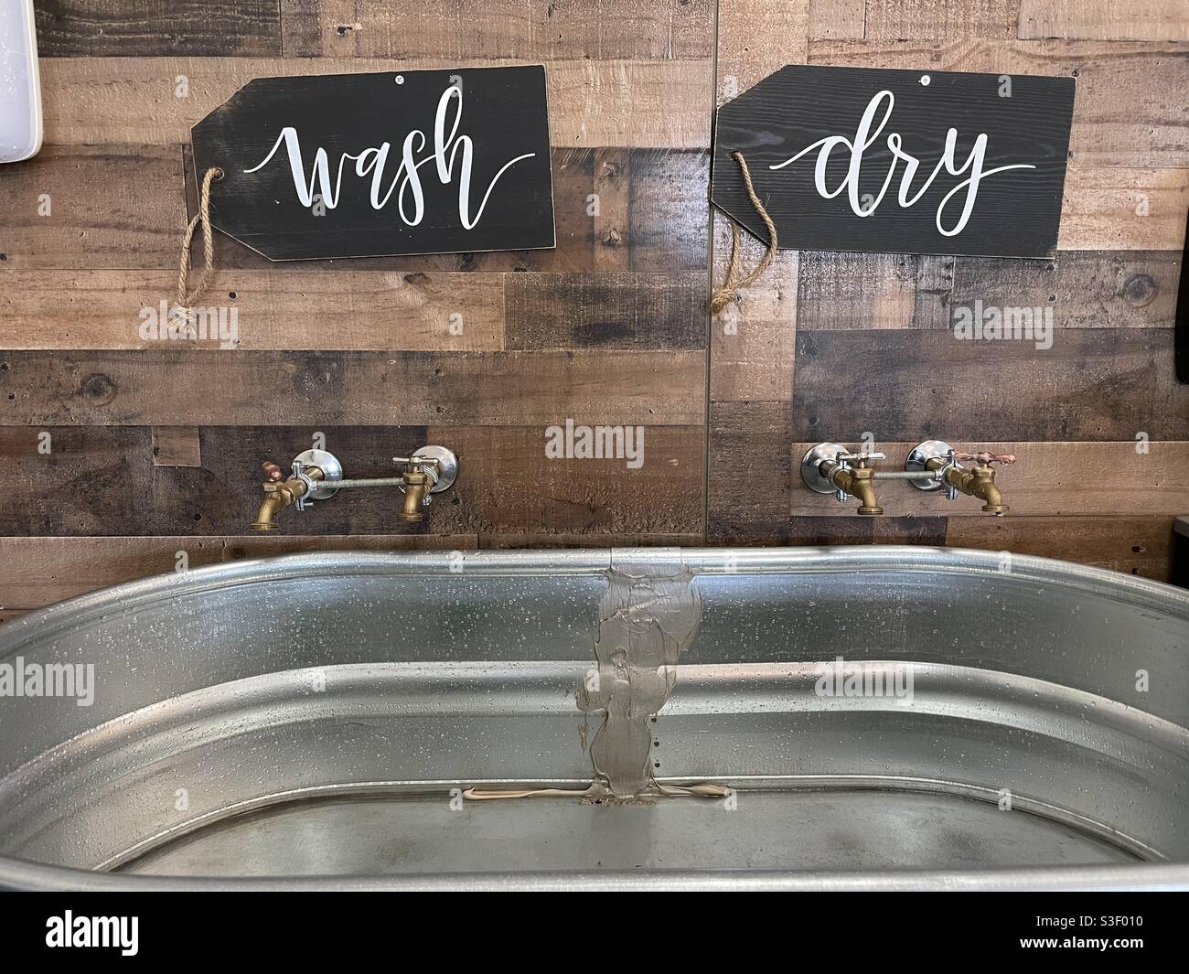 Hand washing station with a trough sink Stock Photo