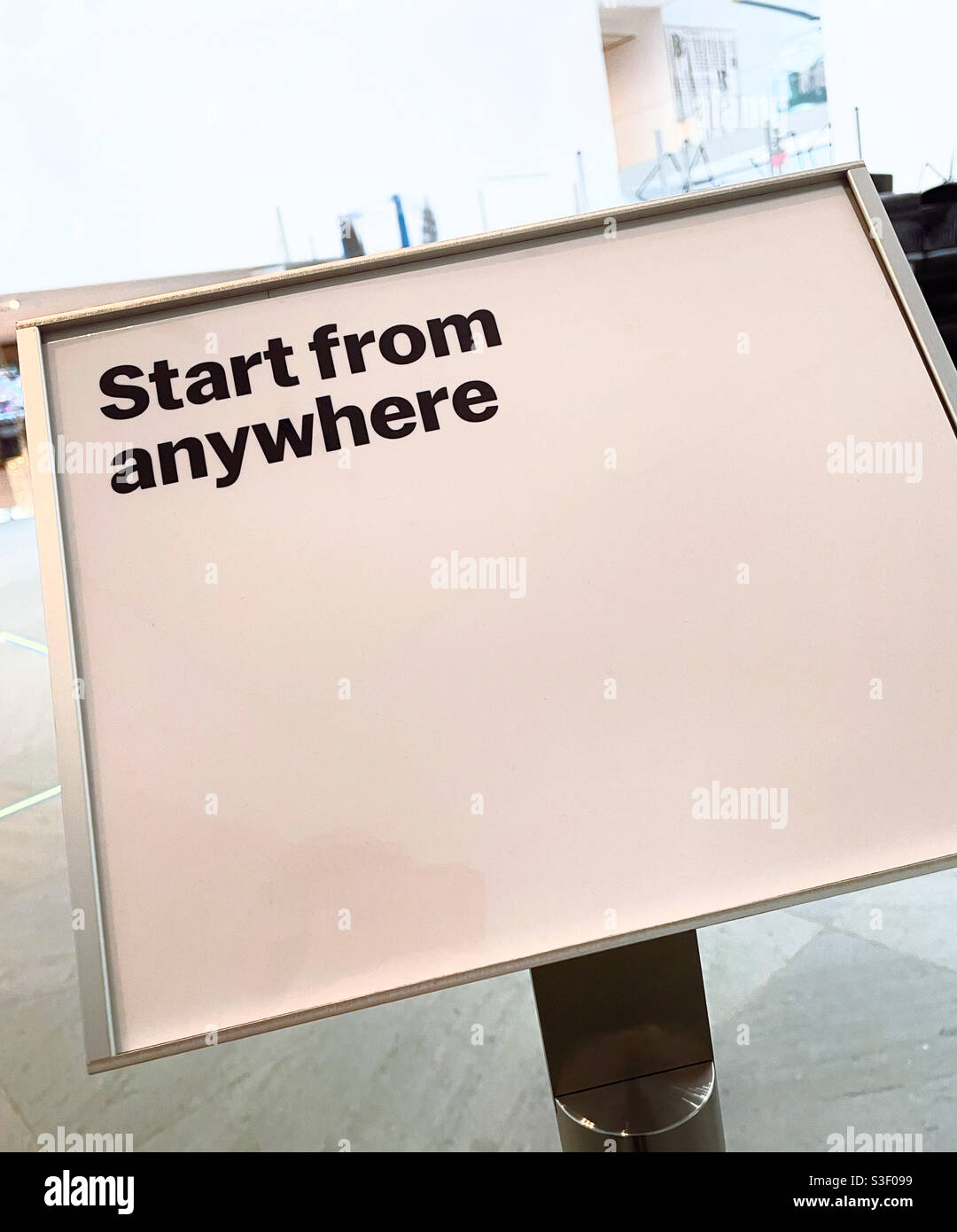 Close up of a printed sign that simply states “start from anywhere“, USA - Smartphone Captured Stock Image