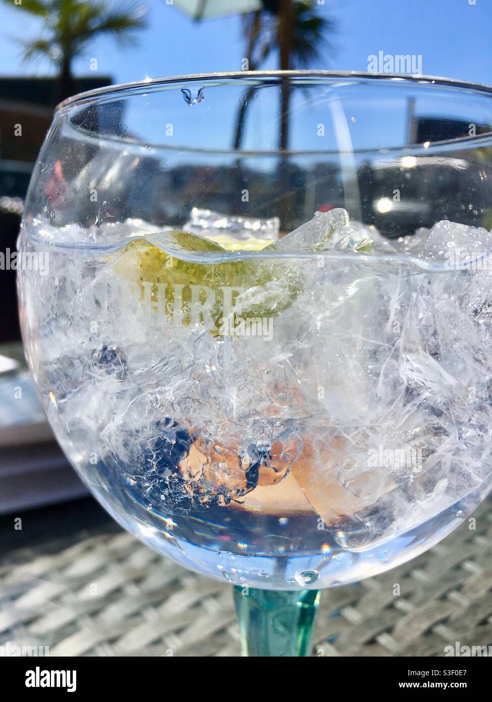 Gin and tonic on ice in Bombay sapphire glass Stock Photo Alamy
