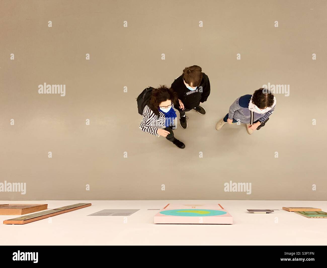 High angle view on people in art exhibition hall - Smartphone Captured Stock Image