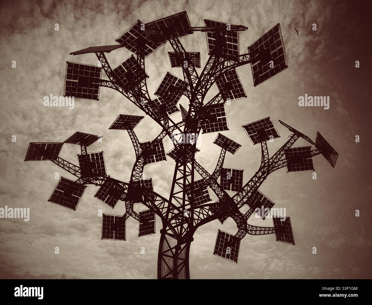 The Solar Power Tree - a sculpture in Bristol, England that actually provides electricity for anybody to charge their portable devices. The harnessing of free sunshine! Photo Credit - ©️ COLIN HOSKINS - Smartphone Captured Stock Image