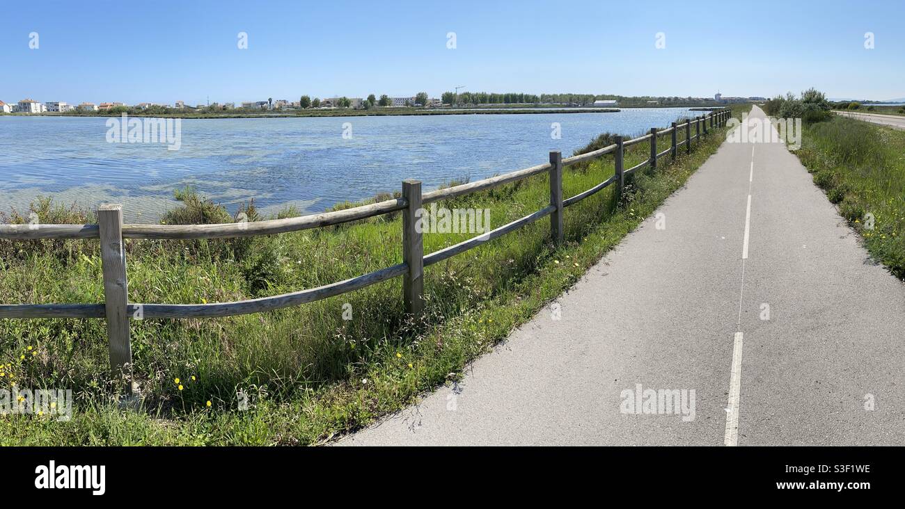 Panorama of a bike path or road along a salt lake, Palavas les Flots, south of France - Smartphone Captured Stock Image