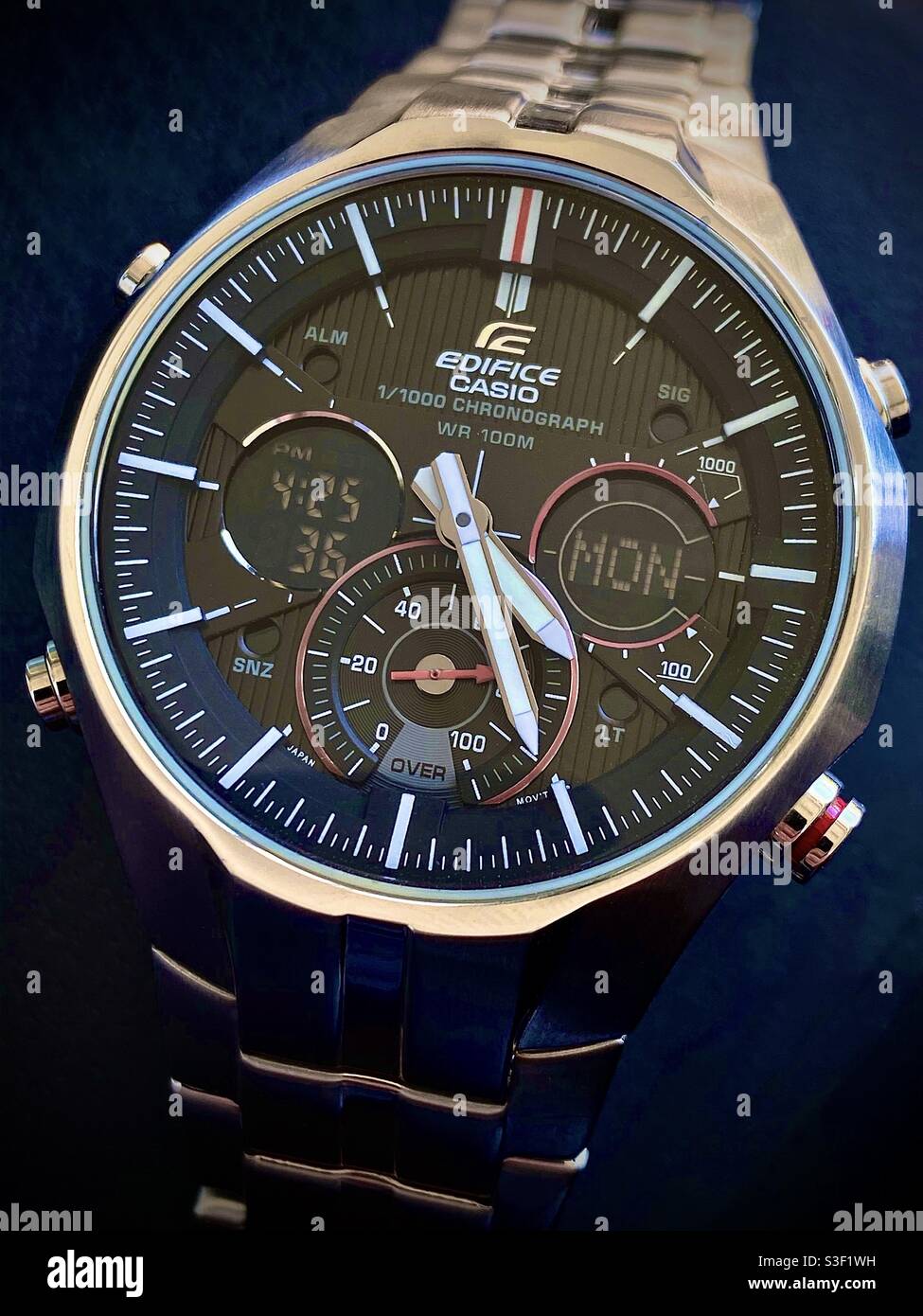 Casio Edifice EFA-135 chronograph quartz wrist watch with brushed and  polished stainless steel bracelet on blue background Stock Photo - Alamy