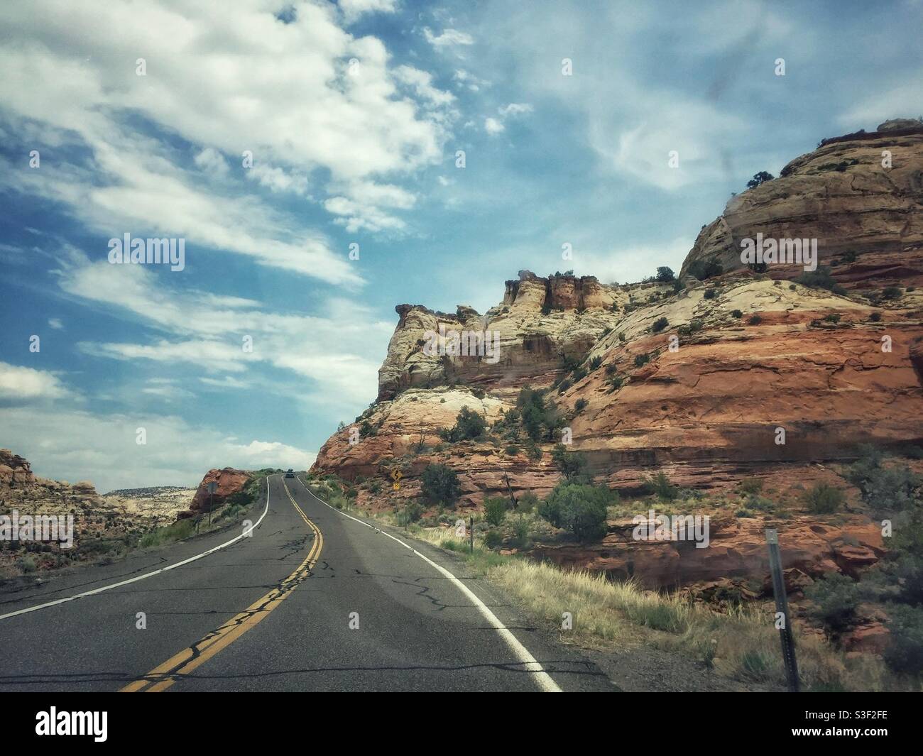 A scenic road in Utah passes spectacular rock formations - Smartphone Captured Stock Image