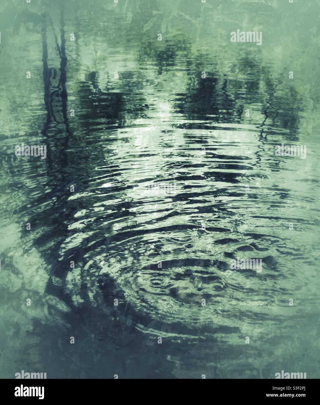 Water ripples on outdoor house patio during heavy rain - Smartphone Captured Stock Image