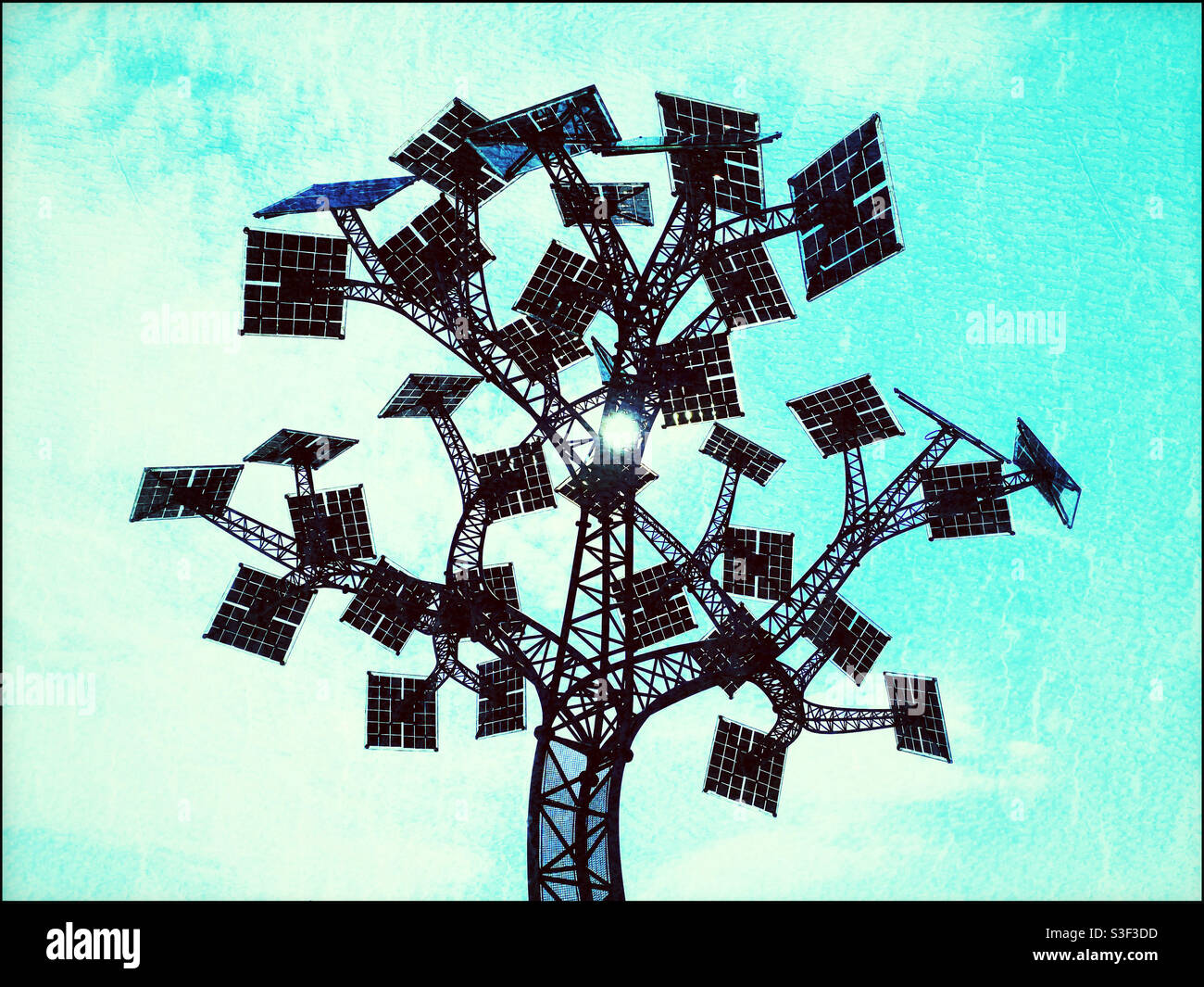 The sun shines directly through the Solar Power Tree in Bristol, England, UK. An art Installation that also provides electrical solar power. Photo ©️ COLIN HOSKINS. - Smartphone Captured Stock Image