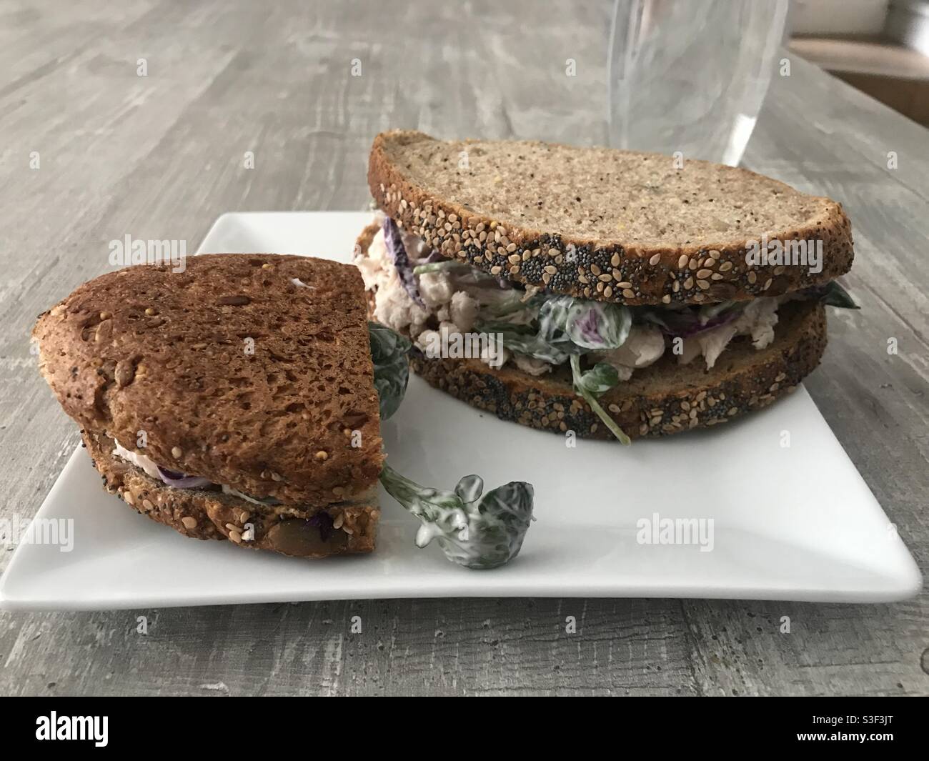 Chicken sandwich with watercress slaw on wholemeal seeded bread - Smartphone Captured Stock Image