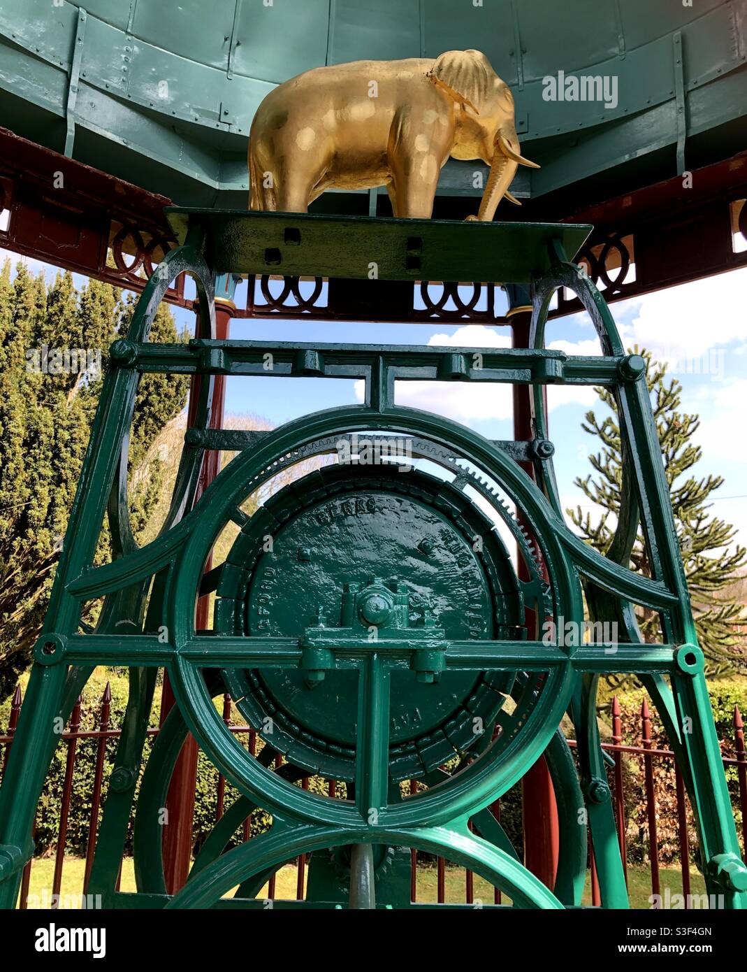 A gilded Indian Elephant on top of the winding mechanism under the canopy of the Maharajah’s Well at Stoke Row, Berkshire, England. Stock Photo