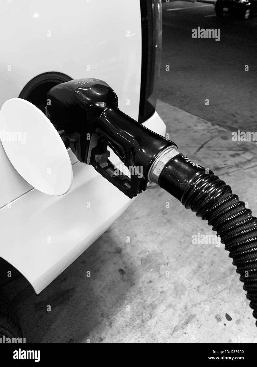 Pumping gas into car Black and White Stock Photos & Images Alamy
