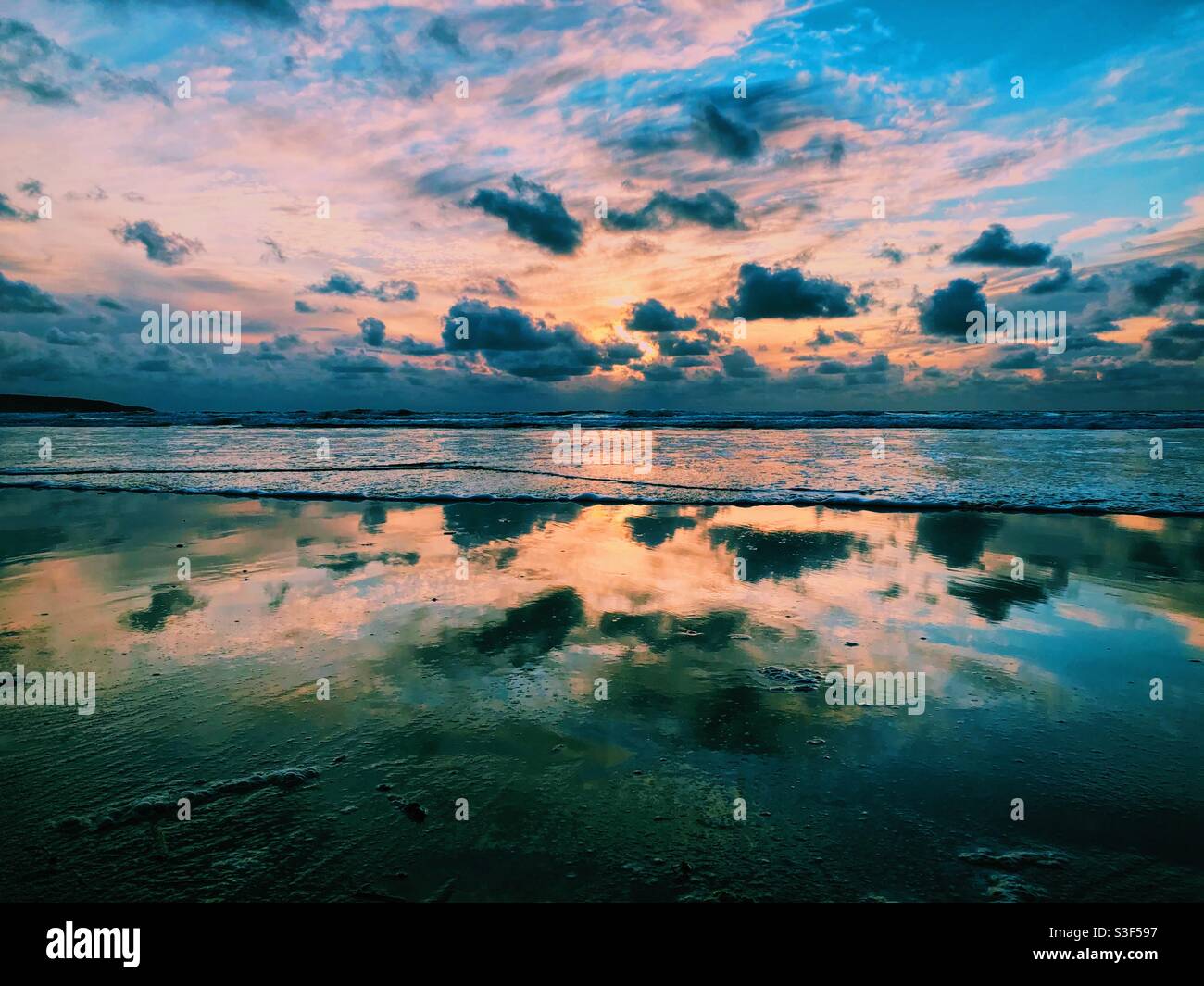 Beautiful dramatic sunset over a beach in Cornwall - Smartphone Captured Stock Image