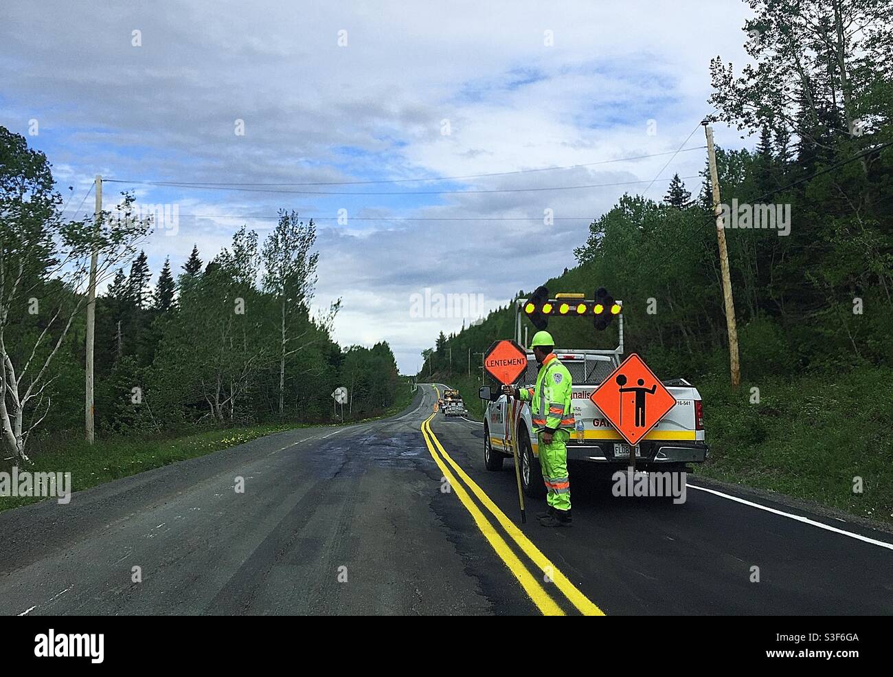 Man Holding Sign Directing Traffic High Resolution Stock Photography And Images Alamy